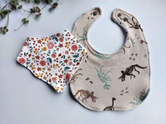 Two different style bibs: one a smaller bandana style and the other a larger traditional style