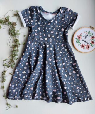 A long childrens dress with short sleeves in navy leopard fabric